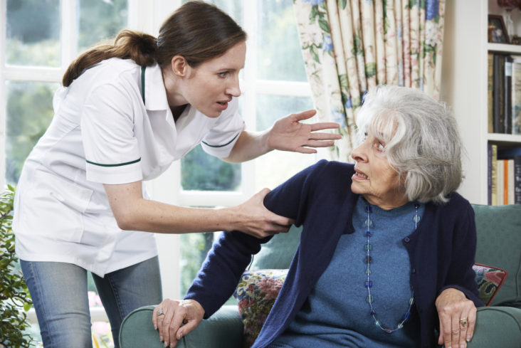 Care Worker Mistreating Senior Woman