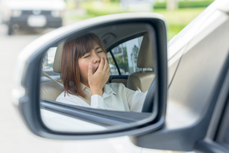 Girl Yawning in Car