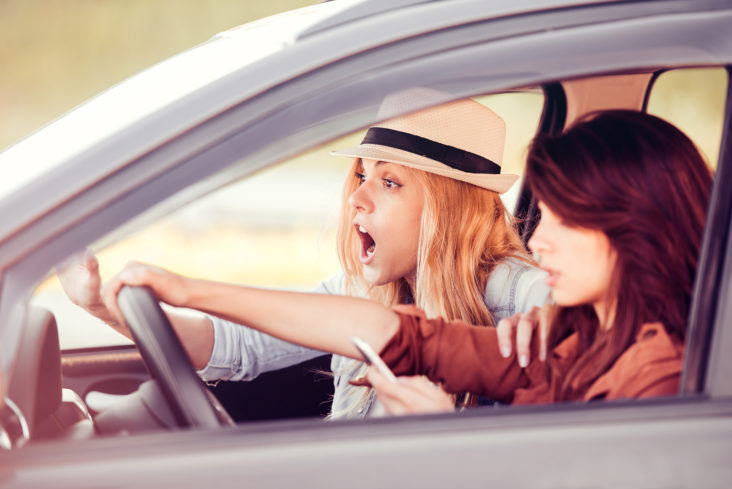 Woman looking at phone about to crash