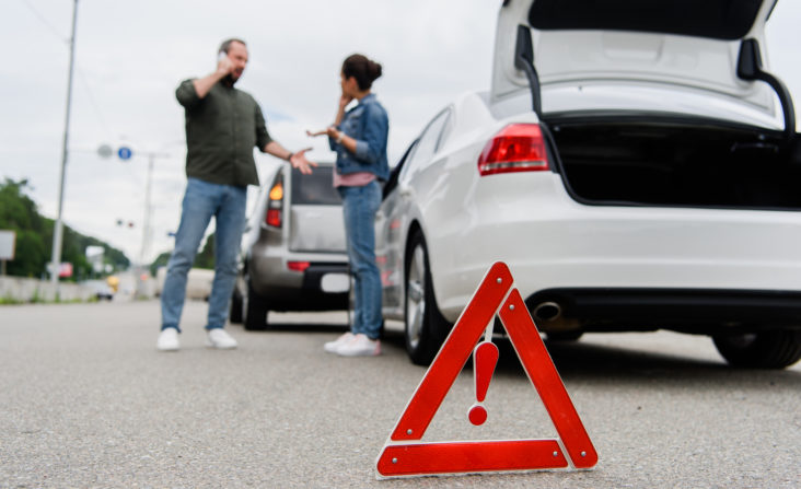 How Poor Car Maintenance Can Cause Accidents - car accident scene on roadside with hazard cone